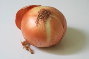 unpeeled onion